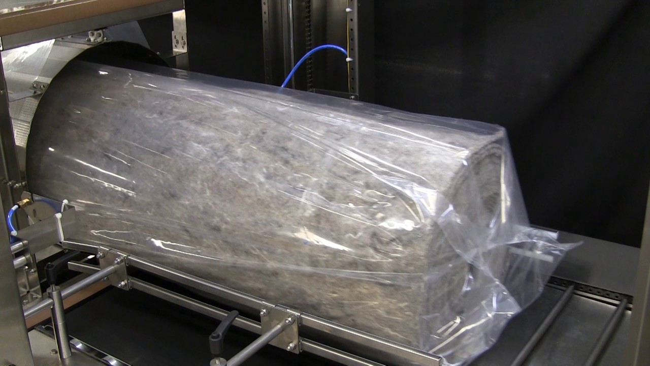 "Efficient Industrial Shrink Wrap Solution for Oversized Textile Rolls